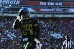 PASADENA, CA - JANUARY 02:  Running back Kenjon Barner #24 of the Oregon Ducks reacts after scoring on a 54-yard reception in the second quarter against the Wisconsin Badgers at the 98th Rose Bowl Game on January 2, 2012 in Pasadena, California.  (Photo by Harry How/Getty Images)