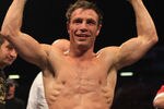 LONDON, ENGLAND - MAY 15:  Michael Katsidis of Australia celebrates beating Kevin Mitchell of England in the third round to retain the WBO Lightweight Championship of the World at Boleyn Ground on May 15, 2010 in London, England.  (Photo by Warren Little/Getty Images)