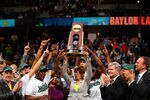 DENVER, CO - APRIL 03:  Head coach Kim Mulkey of the Baylor Bears holds up the National Championship trophy as she celebrates with her players after they won 80-61 against the Notre Dame Fighting Irish during the National Final game of the 2012 NCAA Division I Women's Basketball Championship at Pepsi Center on April 3, 2012 in Denver, Colorado.  (Photo by Doug Pensinger/Getty Images)