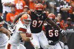 CLEVELAND, OH - SEPTEMBER 11:  Quarterback Colt McCoy #82 of the Cleveland Browns runs from Geno Atkins #97 of the Cincinnati Bengals during the season opener at Cleveland Browns Stadium on September 11, 2011 in Cleveland, Ohio.  (Photo by Matt Sullivan/Getty Images)