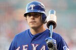ANAHEIM, CA - AUGUST 16:  Ian Kinsler #5 of the Texas Rangers on deck against the Los Angeles Angels of Anaheim at Angel Stadium of Anaheim on August 16, 2011 in Anaheim, California.  (Photo by Harry How/Getty Images)