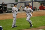 MILWAUKEE, WI - SEPTEMBER 14: Carlos Gonzalez #5 of the Colorado Rockies is congratulated by Rich Dauer #25 after hitting a home run during the game against the Milwaukee Brewers at Miller Park on September 14, 2011 in Milwaukee, Wisconsin. The Rockies defeated the Brewers 6-2. (Photo by Scott Boehm/Getty Images)