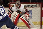 CHICAGO, IL - FEBRUARY 29: Corey Crawford #50 of the Chicago Blackhawks keeps his eyes on the puck against the Toronto Maple Leafs at the United Center on February 29, 2012 in Chicago, Illinois. The Blackhawks defeated the Maple Leafs 5-4. (Photo by Jonathan Daniel/Getty Images)
