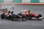 KUALA LUMPUR, MALAYSIA - MARCH 25:  (L-R) Jean-Eric Vergne of France and Scuderia Toro Rosso and Felipe Massa of Brazil and Ferrari drive side by side during the Malaysian Formula One Grand Prix at the Sepang Circuit on March 25, 2012 in Kuala Lumpur, Malaysia.  (Photo by Ker Robertson/Getty Images)