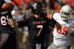 LUBBOCK, TX - NOVEMBER 12:  Seth Doege #7 of the Texas Tech Red Raiders throws against the Oklahoma State Cowboys at Jones AT&T Stadium on November 12, 2011 in Lubbock, Texas.  (Photo by Ronald Martinez/Getty Images)
