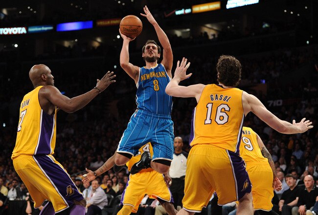 LOS ANGELES, CA - APRIL 26:  Marco Belinelli #8 of the New Orleans Hornets shoots over Lamar Odom #7 and Pau Gasol #16 of the Los Angeles Lakers in Game Five of the Western Conference Quarterfinals in the 2011 NBA Playoffs on April 26, 2011 at Staples Center in Los Angeles, California. NOTE TO USER: User expressly acknowledges and agrees that, by downloading and or using this photograph, User is consenting to the terms and conditions of the Getty Images License Agreement.  (Photo by Harry How/Getty Images)