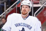 GLENDALE, AZ - FEBRUARY 28:  Daniel Sedin #22 of the Vancouver Canucks during the NHL game against the Phoenix Coyotes at Jobing.com Arena on February 28, 2012 in Glendale, Arizona.  The Coyotes defeated the Canucks 2-1 in an overtime shootout.  (Photo by Christian Petersen/Getty Images)