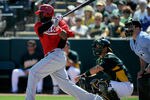 PHOENIX, AZ - MARCH 10:  Brandon Phillips #4 of the Cincinnati Reds plays in the spring training baseball game against the Oakland Athletics at the Phoenix Municipal Stadium on March 10, 2012 in Phoenix, Arizona.  (Photo by Kevork Djansezian/Getty Images)