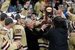 TAMPA, FL - APRIL 05:  Head coach Jerry York of the Boston College Eagles accepts the trophy after their victory over the Ferris State Bulldogs during the NCAA Division 1 Men's Hockey Championship Game at the Tampa Bay Times Forum on April 7, 2012 in Tampa, Florida.  (Photo by J. Meric/Getty Images)