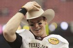 HOUSTON - DECEMBER 31:  Quarterback Ryan Tannehill #17 of Texas A&M Texas A&M Aggies holds his MVP trophy after Texas A&M defeated Northwesten University 33-22 at Reliant Stadium on December 31, 2011 in Houston, Texas.  (Photo by Bob Levey/Getty Images)