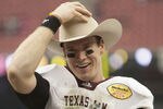HOUSTON - DECEMBER 31:  Quarterback Ryan Tannehill #17 of Texas A&M Texas A&M Aggies holds his MVP trophy after Texas A&M defeated Northwesten University 33-22 at Reliant Stadium on December 31, 2011 in Houston, Texas.  (Photo by Bob Levey/Getty Images)