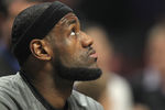 CHICAGO, IL - APRIL 12:  LeBron James #6 of the Miami Heat watches a Chicago Bulls highlight video before a game against the Bulls at the United Center on April 12, 2012 in Chicago, Illinois. NOTE TO USER: User expressly acknowledges and agrees that, by downloading and or using this photograph, User is consenting to the terms and conditions of the Getty Images License Agreement.  (Photo by Jonathan Daniel/Getty Images)