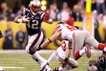 INDIANAPOLIS, IN - FEBRUARY 05:  BenJarvus Green-Ellis #42 of the New England Patriots runs the ball agains Chase Blackburn #93 of the New York Giants during Super Bowl XLVI at Lucas Oil Stadium on February 5, 2012 in Indianapolis, Indiana.  (Photo by Al Bello/Getty Images)