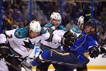ST. LOUIS, MO - APRIL 12: Douglas Murray #3 of the San Jose Sharks tussles with David Perron #57 of the St. Louis Blues during Game One of the Western Conference Quarterfinals during the 2012 NHL Stanley Cup Playoffs at the Scottrade Center on April 12, 2012 in St. Louis, Missouri.  (Photo by Dilip Vishwanat/Getty Images)