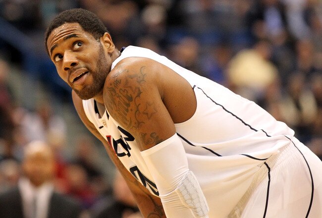 HARTFORD, CT - JANUARY 9:  Alex Oriakhi #34 of the Connecticut Huskies takes a look at the clock in the final minutes of a win against the West Virginia Mountaineers in the second  half at the XL Center on January 9, 2012,  in Hartford, Connecticut.  (Photo by Jim Rogash/Getty Images)