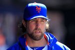 NEW YORK, NY - APRIL 07: R.A. Dickey #43 of the New York Mets looks on from the dugout against the Atlanta Braves at Citi Field on April 7, 2012 in the Flushing neighborhood of the Queens borough of New York City.  (Photo by Chris Trotman/Getty Images)