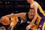 LOS ANGELES, CA - FEBRUARY 29:  Anthony Randolph #15 of the Minnesota Timberwolves is fouled as he dribbles by Troy Murphy #14 of the Los Angeles Lakers at Staples Center on February 29, 2012 in Los Angeles, California.  NOTE TO USER: User expressly acknowledges and agrees that, by downloading and or using this photograph, User is consenting to the terms and conditions of the Getty Images License Agreement.  (Photo by Harry How/Getty Images)