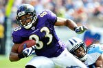 NASHVILLE, TN - SEPTEMBER 18:  Michael Griffin #33 of the Tennessee Titans tackles Lee Evans #83 of the Baltimore Ravens at LP Field on September 18, 2011 in Nashville, Tennessee. Tennessee won 26-13.  (Photo by Grant Halverson/Getty Images)