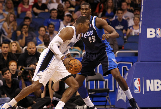 ORLANDO, FL - MARCH 30: Dwight Howard #12 of the Orlando Magic drives