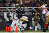 ST. LOUIS, MO - JANUARY 1: Brandon Lloyd #83 of the St. Louis Rams catches a touchdown pass against Donte Whitner #31 of the San Francisco 49ers at the Edward Jones Dome on January 1, 2012 in St. Louis, Missouri.  The 49ers beat the Rams 34-27.  (Photo by Dilip Vishwanat/Getty Images)