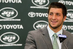 FLORHAM PARK, NJ - MARCH 26:  Quarterback Tim Tebow addresses the media as he is introduced as a New York Jet at the Atlantic Health Jets Training Center on March 26, 2012 in Florham Park, New Jersey. Tebow, traded from the Denver Broncos last week, will be the team's backup quarterback according to Jets head coach Rex Ryan. Tebow, the 2007 Heisman Trophy winner, started 11 games in 2011 for Denver and finished with a 7-4 record as a starter. He led the Broncos to a playoff overtime win against the Pittsburgh Steelers in the first round before eventually losing to the New England Patriots in the next round.  (Photo by Mike Stobe/Getty Images)