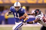 INDIANAPOLIS - NOVEMBER 01: Anthony Gonzalez #11 of Indianapolis Colts runs with the ball while defended by Eugene Wilson #26 of the Houston Texans during the NFL game at Lucas Oil Stadium on November 1, 2010 in Indianapolis, Indiana.  (Photo by Andy Lyons/Getty Images)
