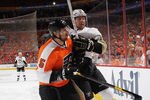 PHILADELPHIA, PA - APRIL 15: Braydon Coburn #5 of the Philadelphia Flyers and James Neal #18 of the Pittsburgh Penguins collide along the boards in Game Three of the Eastern Conference Quarterfinals during the 2012 NHL Stanley Cup Playoffs at Wells Fargo Center on April 15, 2012 in Philadelphia, Pennsylvania. The Flyers defeated the Penguins 8-4. (Photo by Bruce Bennett/Getty Images)