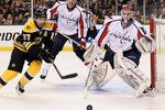 BOSTON, MA - APRIL 12:  Braden Holtby #70 of the Washington Capitals stops a shot by Patrice Bergeron #37 of the Boston Bruins in Game One of the Eastern Conference Quarterfinals during the 2012 NHL Stanley Cup Playoffs at TD Garden on April 12, 2012 in Boston, Massachusetts.  (Photo by Elsa/Getty Images)