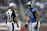 DETROIT, MI - NOVEMBER 24:  Defensive end Ndamukong Suh #90 of the Detroit Lions argues with referee Terry McAulay #77 after Suh is ejected from the game for unsportsmanlike conduct in the third quarter against the Green Bay Packers during the Thanksgiving Day game at Ford Field on November 24, 2011 in Detroit, Michigan.  (Photo by Gregory Shamus/Getty Images)