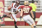 CHESTNUT HILL, MA - SEPTEMBER 25:  Tyrod Taylor #5 of the Virginia Tech Hokies scrambles with the ball as Luke Kuechly #40 of the Boston College Eagles defends on September 25, 2010 at Alumni Stadium in Chestnut Hill, Massachusetts.  (Photo by Elsa/Getty Images)
