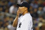 NEW YORK, NY - APRIL 16:  Freddy Garcia #36 of the New York Yankees reacts after giving up a home run against Justin Morneau #33 of the Minnesota Twins  during their game on April 16, 2012 at Yankee Stadium in the Bronx borough of New York City.  (Photo by Al Bello/Getty Images)
