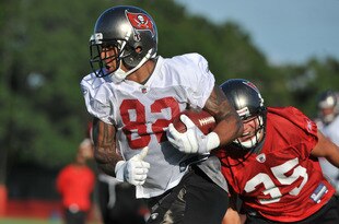 TAMPA, FL - JULY 29:  Tight end Kellen Winslow #82 of the Tampa Bay Buccaneers runs upfield with a pass during the team's first pre-season training camp practice July 29, 2011 at One Buccaneer Place in Tampa, Florida. (Photo by Al Messerschmidt/Getty Images)
