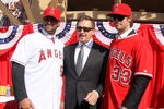 ANAHEIM, CA - DECEMBER 10:  Angels owner Arturo Moreno stands between Albert Pujols #5 and C.J. Wilson #33 at a public press conference introducing them as newly signed Los Angeles Angels of Anaheim  players at Angel Stadium on December 10, 2011 in Anaheim, California.  (Photo by Stephen Dunn/Getty Images)