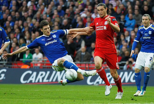 LONDON, ENGLAND - FEBRUARY 26:  Mark Hudson of Cardiff City challenges Andy Carroll of Liverpool during the Carling Cup Final match between Liverpool and Cardiff City at Wembley Stadium on February 26, 2012 in London, England.  (Photo by Paul Gilham/Getty Images)