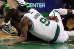 BOSTON, MA - MAY 07: Rajon Rondo #9 of the Boston Celtics injures his arm as he lands on the court after a scramble with Dwyane Wade #3 of the Miami Heat in Game Three of the Eastern Conference Semifinals in the 2011 NBA Playoffs on May 7, 2011 at the TD Garden in Boston, Massachusetts.  NOTE TO USER: User expressly acknowledges and agrees that, by downloading and or using this photograph, User is consenting to the terms and conditions of the Getty Images License Agreement.  (Photo by Elsa/Getty Images)