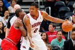 ATLANTA, GA - MARCH 28:  Joe Johnson #2 of the Atlanta Hawks drives against Ronnie Brewer #11 of the Chicago Bulls at Philips Arena on March 28, 2012 in Atlanta, Georgia.  NOTE TO USER: User expressly acknowledges and agrees that, by downloading and or using this photograph, User is consenting to the terms and conditions of the Getty Images License Agreement.  (Photo by Kevin C. Cox/Getty Images)