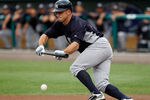 FORT MYERS, FL - MARCH 22:  Outfielder Brett Gardner #11 of the New York Yankees leads off with a bunt against the Boston Red Sox during a Grapefruit League Spring Training Game at JetBlue Park on March 22, 2012 in Fort Myers, Florida.  (Photo by J. Meric/Getty Images)