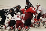 CHICAGO, IL - APRIL 17:  Referees try to break up a fight between members of the Chicago Blackhawks and the Phoenix Coyotes following a hit on Marian Hossa of the Blackhawks by Raffi Torres of the Coyotes in Game Three of the Western Conference Quarterfinals during the 2012 NHL Stanley Cup Playoffs at the United Center on April 17, 2012 in Chicago, Illinois. The Coyotes defeated the Blackhawks 3-2 in overtime.  (Photo by Jonathan Daniel/Getty Images)