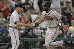 HOUSTON - APRIL 11:  Jason Heyward #22 of the Atlanta Braves receives congratulations from third base coach Brian Snitker after hitting a home run in the eighth inning against the Houston Astros at Minute Maid Park on April 11, 2012 in Houston, Texas.  (Photo by Bob Levey/Getty Images)