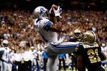 NEW ORLEANS, LA - JANUARY 07:   Calvin Johnson #81 of the Detroit Lions makesa touchdown catch against  Patrick Robinson #21 of the New Orleans Saints during their 2012 NFC Wild Card Playoff game at Mercedes-Benz Superdome on January 7, 2012 in New Orleans, Louisiana.  (Photo by Chris Graythen/Getty Images)