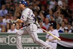 BOSTON, MA - APRIL 17: Josh Hamilton #32 of the Texas Rangers hits a three run homer in the eighth inning against the Boston Red Sox  on April 17, 2012 at Fenway Park in Boston, Massachusetts.  (Photo by Elsa/Getty Images)