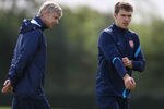 ST ALBANS, ENGLAND - SEPTEMBER 12: Arsene Wenger, manager of Arsenal with Aaron Ramsey of Arsenal during a training session ahead of their UEFA Champions League Group match against Borussia Dortmund at London Colney on September 12, 2011 in St Albans, England. (Photo by Julian Finney/Getty Images)