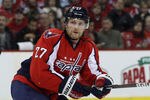 WASHINGTON, DC - DECEMBER 09:  Karl Alzner #27 of the Washington Capitals skates against the Toronto Maple Leafs at the Verizon Center on December 9, 2011 in Washington, DC. The Capitals defeated the Maple Leafs 4-2.  (Photo by Bruce Bennett/Getty Images)