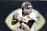 HOUSTON - DECEMBER 31:  Quarterback Ryan Tannehill #17 of Texas A&M Aggies rolls out looking for a receiver against Northwestern Wildcats at Reliant Stadium on December 31, 2011 in Houston, Texas.  (Photo by Bob Levey/Getty Images)