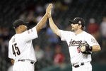 HOUSTON - APRIL 09:  Carlos Lee #45 of the Houston Astros high-fives Travis Buck #6 after defeating the Atlanta Braves at Minute Maid Park on April 9, 2012 in Houston, Texas.  (Photo by Bob Levey/Getty Images)