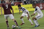 COMMERCE CITY, CO - JUNE 18:  Conor Casey #9 of the Colorado Rapids controls the ball against the defense of A.J. DeLaGarza #20 and Sean Franklin #5 of the Los Angeles Galaxy at Dick's Sporting Goods Park on June 18, 2011 in Commerce City, Colorado. The Galaxy defeated the Rapids 3-1.  (Photo by Doug Pensinger/Getty Images)
