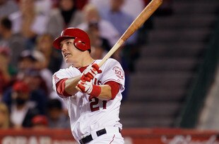 ANAHEIM, CA - SEPTEMBER 26:  Mike Trout #27 of the Los Angeles Angels of Anaheim hits an RBI single against the Texas Rangers in the sixth inning at Angel Stadium of Anaheim on September 26, 2011 in Anaheim, California. The Rangers defeated the Angels 4-3.  (Photo by Jeff Gross/Getty Images)