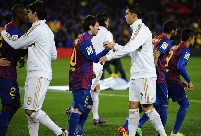 BARCELONA, SPAIN - JANUARY 25: Lionel Messi of FC Barcelona (L) shakes hands with Cristiano Ronaldo of Real Madrid prior to the Copa del Rey quarter final second leg match between FC Barcelona and Real Madrid at Camp Nou on January 25, 2012 in Barcelona, Spain. (Photo by David Ramos/Getty Images)