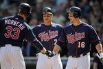 MINNEAPOLIS, MN - APRIL 12: Joe Mauer #7 and Josh Willingham #16 of the Minnesota Twins congratulate Justin Morneau #33 of the Minnesota Twins on a two run home run against the Los Angeles Angels of Anaheim during the eighth inning on April 12, 2012 at Target Field in Minneapolis, Minnesota. The Twins defeated the Angels 10-9. (Photo by Hannah Foslien/Getty Images)