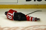 CHICAGO, IL - APRIL 17:  Marian Hossa #81 of the Chicago Blackhawks lays on the ice following a collison with Raffi Torres of the Phoenix Coyotes in Game Three of the Western Conference Quarterfinals during the 2012 NHL Stanley Cup Playoffs at the United Center on April 17, 2012 in Chicago, Illinois. The Coyotes defeated the Blackhawks 3-2 in overtime. (Photo by Jonathan Daniel/Getty Images)